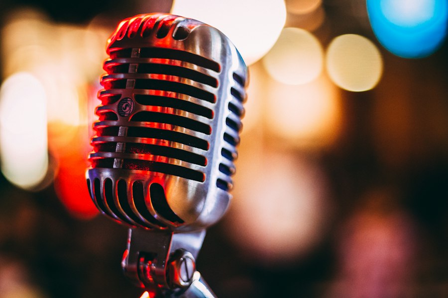 A vintage microphone in warm red light